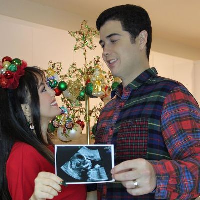 Picture of Anna Maria Perez de and her husband Scott Kline jr announcing their first baby on the occasion of Anna's birthday and christmas.